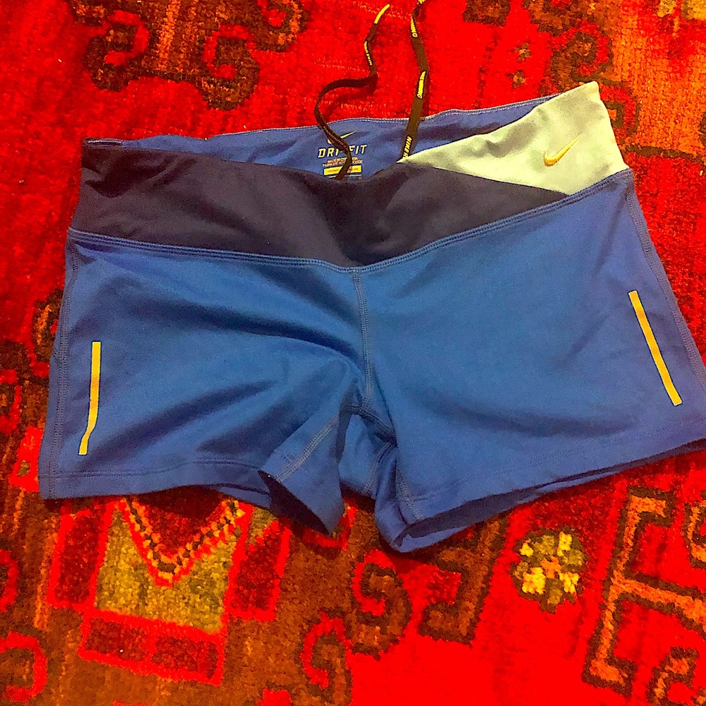 Nike Running shorts w/ draw string, inner waistband pocket.